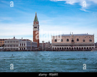 San Marco square or piazza and Doges Palace panoramic view from speed boat on sea or canal Beautiful renaissance italian architecture landmarks of Venezia Venetian cityscape travel background Day time.