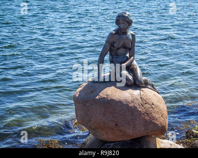 COPENHAGEN, DENMARK-APRIL 11, 2016: Bronze statue of the Little Mermaid by Edvard Eriksen