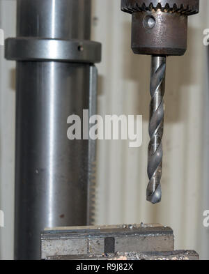 A large drill bit in the workshop with bokeh background. Stock Photo