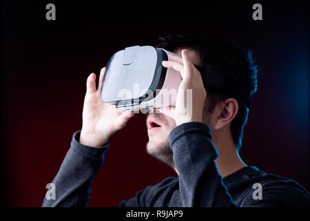 Photo of surprised young guy with glasses of virtual reality Stock Photo