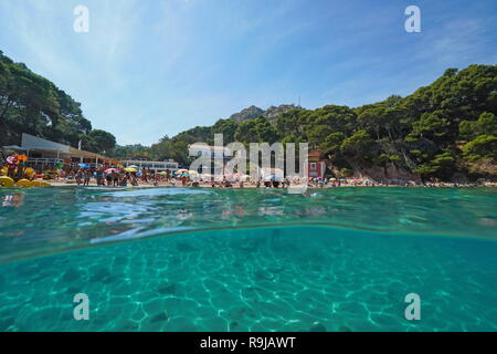 Spain Mediterranean sea summer vacation at Aiguablava beach, split view above and below water surface, Begur, Catalonia, Costa Brava Stock Photo