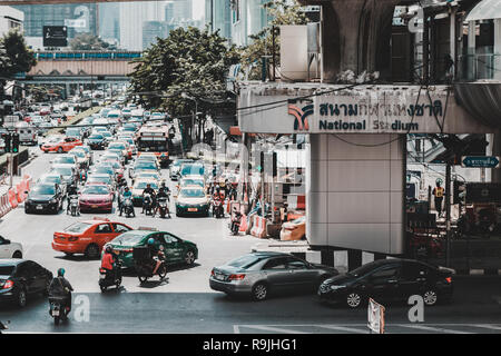 Traffic jam at Rama I junction in Siam Square under National Stadium BTS skytrain station Stock Photo