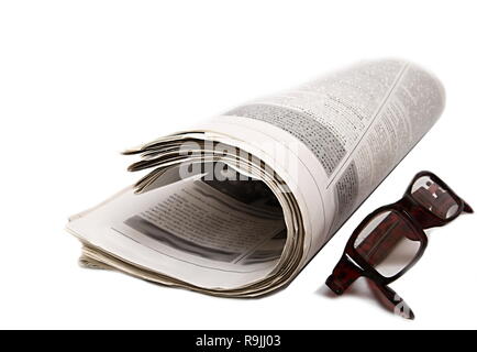 newspaper piled up on a table in a office no people stock photo Stock Photo