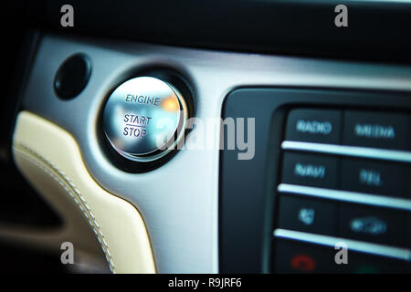 Start stop engine modern new car button Stock Photo