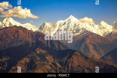 Himalaya snow peaks with barren mountain ranges as viewed on trek to Khaliya top at Munsiyari Uttarakhand India. Stock Photo