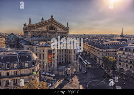 Paris roofs viewed from Haussmann boulevard with the famous Palais Garnier and the Eiffel tower