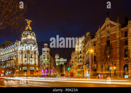 Madrid by night, capital city of Spain, view from Calle de Alcala street to Metropolis Building, Gran Via street and San Jose church Stock Photo