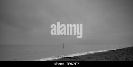 Navigation markers at the foreshore on a grey cloudy day in Bognor Regis, West Sussex, UK Stock Photo