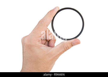 hand holding clear camera filter isolated on white with clipping path Stock Photo