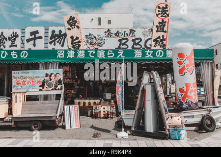 Seafood stores in Numazu Fish Market, where seafood, fish and other related goods are on sale. Stock Photo