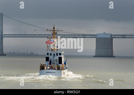 United States US Coast Guard vessel Sockeye patrolling in San Francisco Bay, heading towards the Oakland Bay Bridge Stock Photo