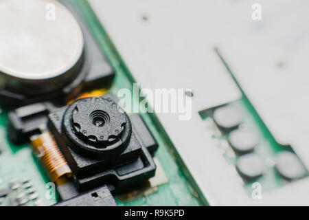 Close up camera inside electronic circuit board smart phone. disassembled cell phone parts. Stock Photo