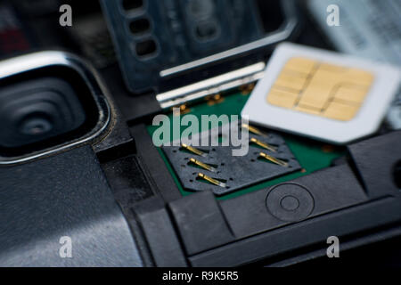 Sim card slot / socket in mobile smart phone close up. Stock Photo