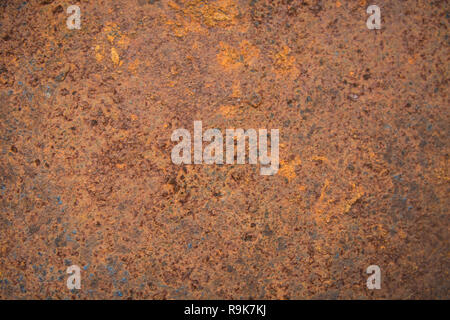 Brown rust stains texture of the old white paint on rusty metal wall. Rusty metal background. Stock Photo