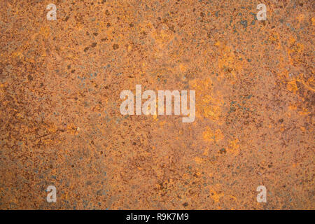 Brown rust stains texture of the old white paint on rusty metal wall. Rusty metal background. Stock Photo