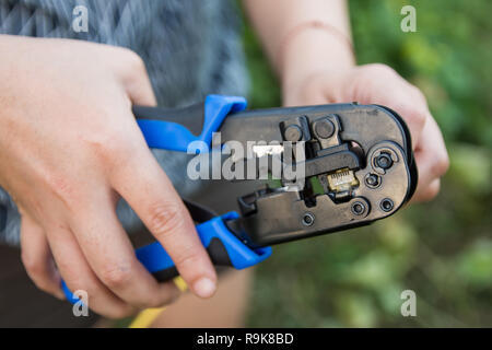 Assembly LAN cable to RJ45 with lan cable clamp Stock Photo