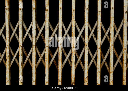 Old folding metal door gate. old rusty iron slide door Stock Photo