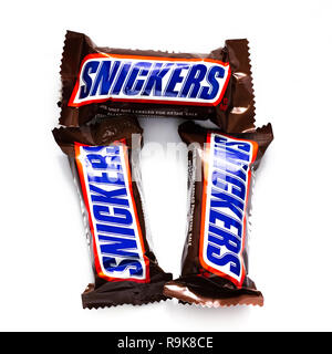 Three Fun Size Snickers candy bars isolated on white. Stock Photo