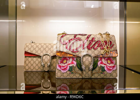 ROME, ITALY - CIRCA NOVEMBER, 2017: bags on display at a Gucci store in Fiumicino International Airport. Stock Photo