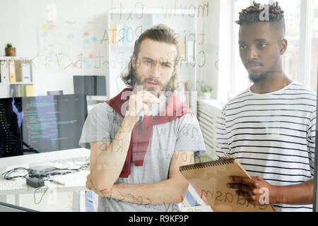 Guys by board Stock Photo