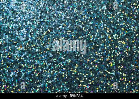 Colorful macro abstract background of whimsical confetti glitter in shades of turquoise blue Stock Photo