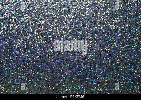 Colorful macro abstract background of whimsical confetti glitter in shades of blue and grey Stock Photo