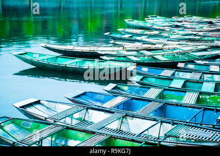 Amazing morning view with Vietnamese boats at river, Tam Coc, Ninh Binh in Vietnam travel landscape and destinations Stock Photo