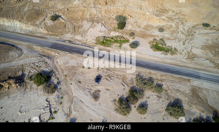 Aerial Photography with a drone. Route 90 that runs along the Dead Sea, Israel. Route 90 is the longest Israeli road, at about 480 kilometres (300 mi) Stock Photo