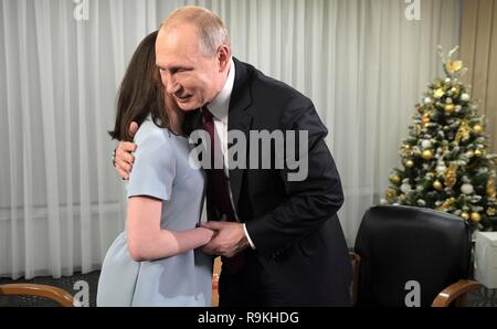 Russian President Vladimir Putin greets young blind journalist Regina Parpiyeva, 17, before an exclusive interview with following the annual news conference at the Kremlin December 20, 2018 in Moscow, Russia. Parpiyeva is a participant in the Dream with Me charity project supported by Putin.