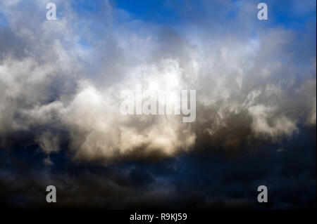 Cumulus congestus clouds with dramatic ominus clouds Stock Photo