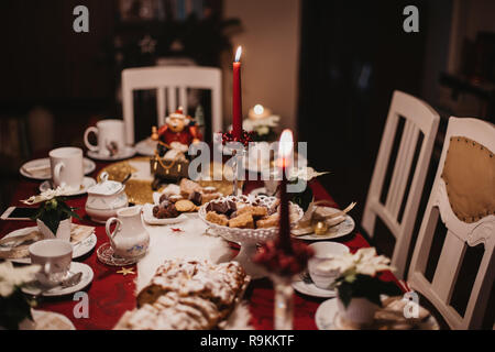 cookies and stollen on a festive table ready laid on Christmas eve Stock Photo