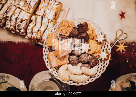 cookies and stollen on a festive table ready laid on Christmas eve Stock Photo