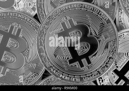 Many silver bitcoins. Cryptocurrency and virtual money concept. Shiny coins with bitcoin symbol. Flat lay top view. Macro Stock Photo