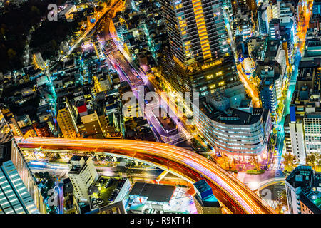 Asia Business concept for real estate & corporate construction - panoramic modern city skyline night view with expressway in Ikebukuro district, Tokyo Stock Photo