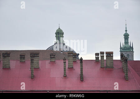 Fragment of a metal roof of the restored old multi-storey building in Lviv, Ukraine Stock Photo