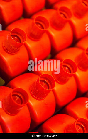Red plastic tops on plastic bottles Stock Photo