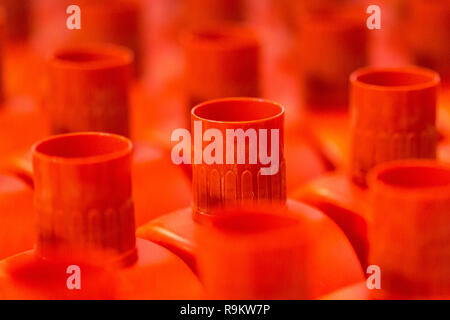 Red plastic tops on plastic bottles Stock Photo