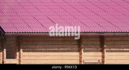 House with a roof made of solid metal sheets, shaped like an old tile Stock Photo