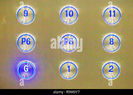 Elevator buttons pressed G down to ground floor. Elevator button showing G floor. Stock Photo