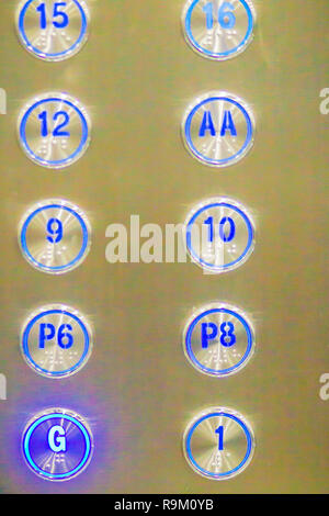 Elevator buttons pressed G down to ground floor. Elevator button showing G floor. Stock Photo