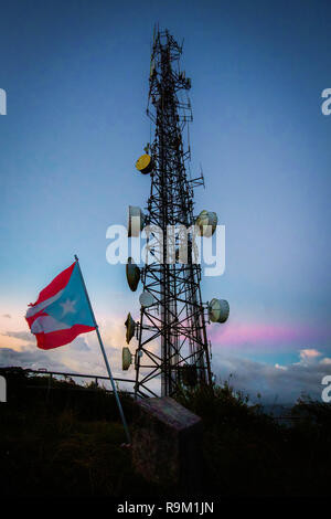 Telecommunication transmitting tower at dawn on top mountain Stock Photo