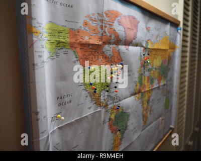 Pins in World Map focused on North America Stock Photo