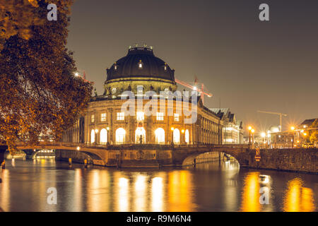 Museum Island at night in the center of Berlin. autumn mood on the river spree with bridges. Light reflects in the water from the river. Stock Photo