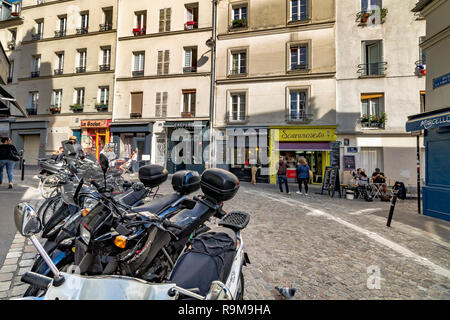 Motor Scooters and mopeds parked on Rue la Vieuville, Montmartre, Paris, France Stock Photo