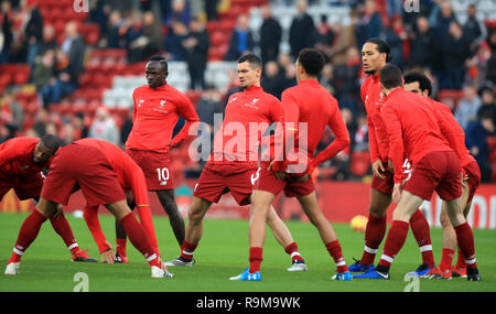 Liverpool's Sadio Mane (third left), Dejan Lovren (centre) and Virgil van Dijk (third right) warm up before the Premier League match at Anfield, Liverpool. Stock Photo