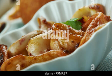 Adobong Pusit , Squid Adobo, Filipino cuisine, Traditional assorted dishes, Top view. Stock Photo