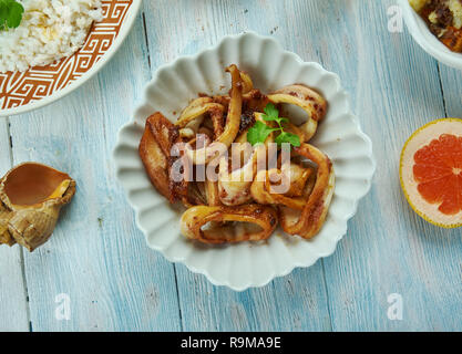 Adobong Pusit , Squid Adobo, Filipino cuisine, Traditional assorted dishes, Top view. Stock Photo