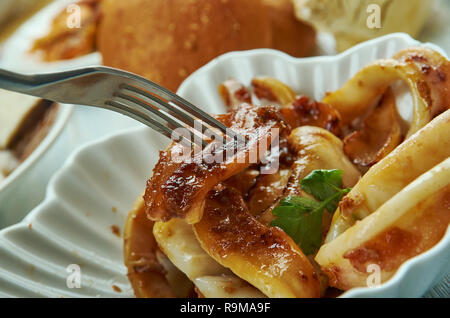 Adobong Pusit , Squid Adobo, Filipino cuisine, Traditional assorted dishes, Top view. Stock Photo