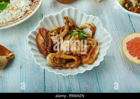 Adobong Pusit , Squid Adobo, Filipino cuisine, Traditional assorted dishes, Top view. Stock Photo