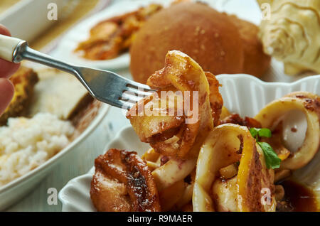 Adobong Pusit , Squid Adobo, Filipino cuisine, Traditional assorted dishes, Top view. Stock Photo